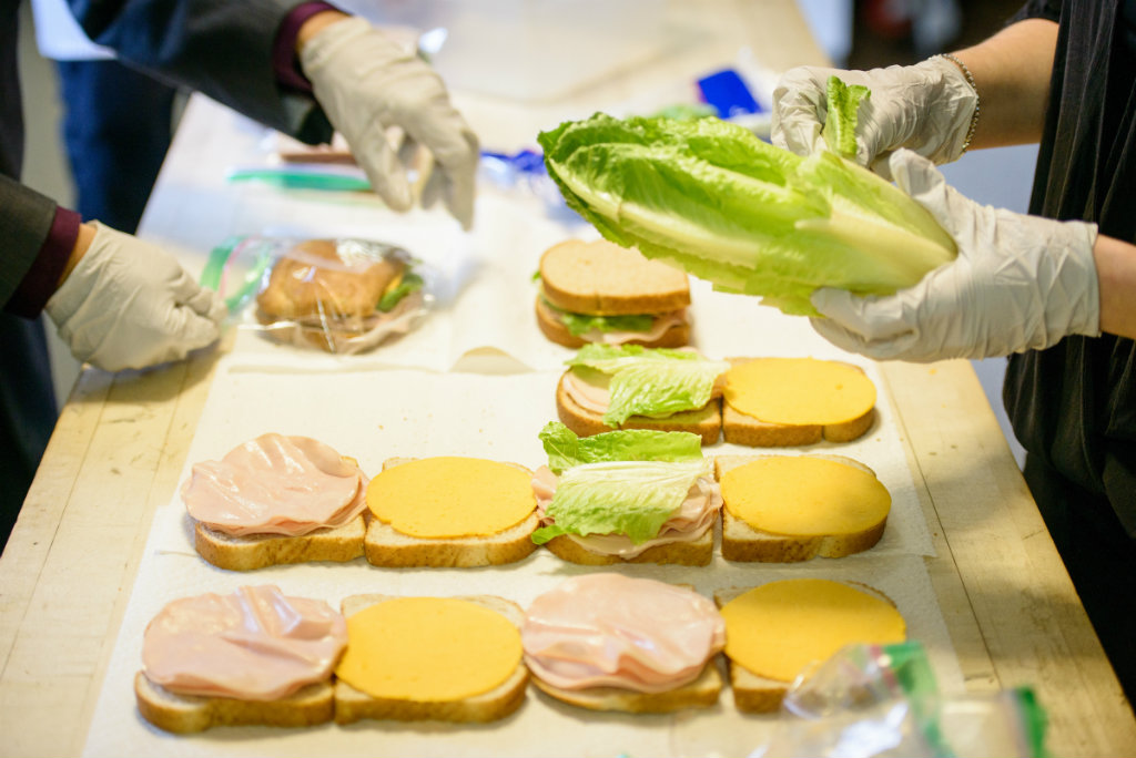 Student volunteers Brandon Price (left) and Kristi Nowak make sandwiches for the homeless ministry at First Trinity Evangelical–Lutheran Church on Sunday, Nov. 20, 2016, in Pittsburgh. LCMS Communications/Erik M. Lunsford